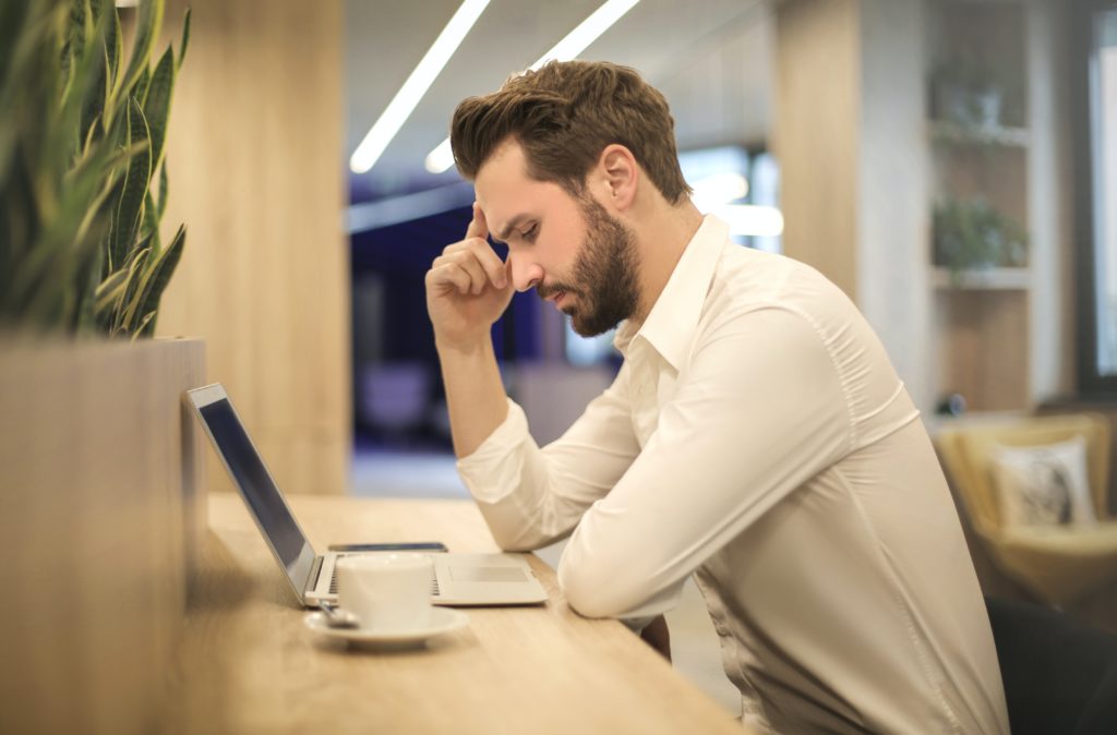 Man at desk on his laptop