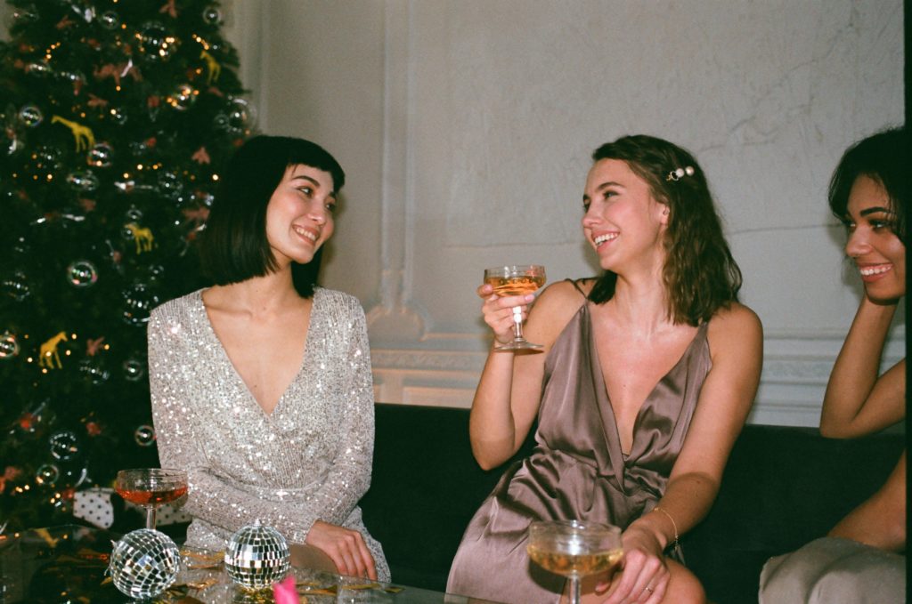 Women drinking champagne at party